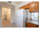 Kitchen featuring white refrigerator, granite countertops, and view to another room at 131 N Higley Rd # 41, Mesa, AZ 85205