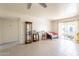 Spacious living room featuring tile floors, a ceiling fan, and sliding doors to the patio at 131 N Higley Rd # 41, Mesa, AZ 85205