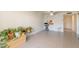 Spacious living area with tile floors, open to the kitchen, and a ceiling fan at 131 N Higley Rd # 41, Mesa, AZ 85205