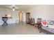Bright living room with tile floors, ceiling fan, and seamless flow to dining area at 131 N Higley Rd # 41, Mesa, AZ 85205