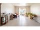 Open living space with sliding door access to outdoor space and tile flooring at 131 N Higley Rd # 41, Mesa, AZ 85205