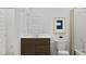 A well-lit bathroom features a sleek vanity with sink, a modern toilet, and a shower with neutral-toned curtain at 1385 W Ridge Rd, Apache Junction, AZ 85120