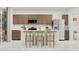 Modern kitchen with stainless steel appliances, white countertops, and a center island with seating at 1385 W Ridge Rd, Apache Junction, AZ 85120