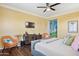 Cozy bedroom with a flat-screen TV, reading chairs, and decorative touches to create a relaxing ambiance at 15562 W Cameron Dr, Surprise, AZ 85379