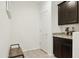 Functional mudroom with custom cabinets, granite counters and bench seating at 15562 W Cameron Dr, Surprise, AZ 85379