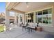 Covered patio area with comfortable seating and natural light at 15562 W Cameron Dr, Surprise, AZ 85379