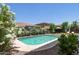 Backyard pool surrounded by desert landscaping at 15562 W Cameron Dr, Surprise, AZ 85379