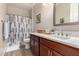 Bathroom featuring wood floors, vanity, and shower at 15740 W Washington St, Goodyear, AZ 85338