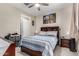 Cozy bedroom with ceiling fan, natural light, and comfortable sleeping arrangements at 15740 W Washington St, Goodyear, AZ 85338