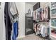 Organized walk-in closet with ample storage, shelving, and hanging space for clothes and accessories at 15740 W Washington St, Goodyear, AZ 85338