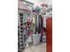 Walk-in closet features ample storage with shelves, hanging rods, and functional organization at 15740 W Washington St, Goodyear, AZ 85338