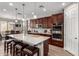 Stylish kitchen features a large island, pendant lights, and modern appliances at 15740 W Washington St, Goodyear, AZ 85338