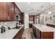 Modern kitchen with stainless steel appliances and a spacious center island at 15740 W Washington St, Goodyear, AZ 85338