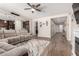 Spacious living room featuring an open floor plan, wood-look floors, and lots of natural light at 15740 W Washington St, Goodyear, AZ 85338