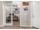 Inviting home office with a ceiling fan and glass doors for privacy at 15740 W Washington St, Goodyear, AZ 85338