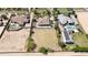 Expansive lot with desert landscaping, complemented by surrounding luxury homes with pools and refined architecture at 16386 W Papago St, Goodyear, AZ 85338