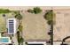 Spacious lot with desert landscaping, ready for custom build, next to home with pool and solar panels at 16386 W Papago St, Goodyear, AZ 85338