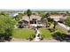 Beautiful home with a meticulously landscaped yard, mature palms, and a stone entrance, offering great curb appeal at 16386 W Papago St, Goodyear, AZ 85338