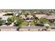 Lovely property showcasing a home with lush landscaping, mature trees, and an inviting stone-detailed entrance at 16386 W Papago St, Goodyear, AZ 85338