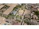 Aerial view showcases the neighborhood with ample lot sizes and custom home designs in the community at 16386 W Papago St, Goodyear, AZ 85338