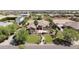 Desirable home with a beautifully landscaped yard, mature palm trees, and a charming stone-accented entrance at 16386 W Papago St, Goodyear, AZ 85338