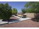 Well-maintained driveway with a vintage truck, surrounded by desert landscaping and a fenced-in backyard at 16386 W Papago St, Goodyear, AZ 85338