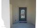Decorative iron front door welcomes you to the home at 16386 W Papago St, Goodyear, AZ 85338