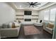 Modern living room with fireplace, comfortable seating, and stylish decor at 16386 W Papago St, Goodyear, AZ 85338
