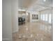 Expansive living room features an open layout with kitchen, dining, and fireplace ready for relaxation at 16386 W Papago St, Goodyear, AZ 85338