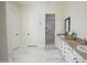 Bathroom featuring double sinks with granite counters and separate shower at 16386 W Papago St, Goodyear, AZ 85338
