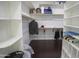 Walk-in closet featuring built-in shelves for organized storage at 16386 W Papago St, Goodyear, AZ 85338