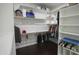 Spacious walk-in closet with custom shelving and wood floor at 16386 W Papago St, Goodyear, AZ 85338