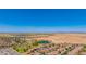 Scenic aerial view captures the neighborhood's proximity to lush fields, providing a serene backdrop and a harmonious blend of rural and urban living at 19324 N Del Mar Ave, Maricopa, AZ 85138