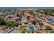 Aerial view of a community displaying the expansive lot with a pool and other neighborhood homes at 19324 N Del Mar Ave, Maricopa, AZ 85138