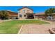 Spacious backyard features lush lawn, mature trees, pool potential, and brick-paver patio area at 19324 N Del Mar Ave, Maricopa, AZ 85138