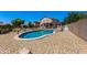 Wide backyard features pool, spa, and lush landscaping, perfect for relaxation and outdoor enjoyment at 19324 N Del Mar Ave, Maricopa, AZ 85138