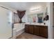 Bathroom with enclosed shower, double sinks and plenty of light at 19324 N Del Mar Ave, Maricopa, AZ 85138