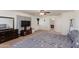 Primary bedroom with dresser and full bathroom at 19324 N Del Mar Ave, Maricopa, AZ 85138
