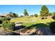 Lush green community park with winding sidewalk and manicured landscaping in a residential area at 19324 N Del Mar Ave, Maricopa, AZ 85138