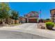 Inviting two-story house with a manicured lawn, ample driveway, and a welcoming American flag at 19324 N Del Mar Ave, Maricopa, AZ 85138