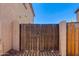 A gated side yard entrance showing access to the yard and neighbor's area at 19324 N Del Mar Ave, Maricopa, AZ 85138