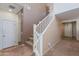 Carpeted stairway with white wooden railing at 19324 N Del Mar Ave, Maricopa, AZ 85138