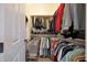 Functional closet with plenty of shelving and storage space for clothes and accessories at 19334 W Pasadena Ave, Litchfield Park, AZ 85340