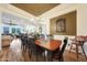 Dining room showcasing wooden table and chairs with chandelier lighting and an open floor plan at 19334 W Pasadena Ave, Litchfield Park, AZ 85340