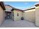 Close up of a home's front entrance showcasing a decorative iron door and stone accents at 19334 W Pasadena Ave, Litchfield Park, AZ 85340