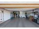 Clean and organized garage with epoxy flooring and ample storage space at 19334 W Pasadena Ave, Litchfield Park, AZ 85340