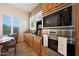 Well-lit kitchen with stainless steel oven, microwave, countertops, and wooden cabinets at 19334 W Pasadena Ave, Litchfield Park, AZ 85340