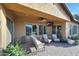Covered patio featuring comfortable seating and an outdoor television at 19334 W Pasadena Ave, Litchfield Park, AZ 85340