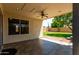 Inviting covered patio with ceiling fan and tile flooring, perfect for outdoor relaxation and entertaining at 19833 N 47Th Ln, Glendale, AZ 85308