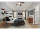 Modern bedroom with neutral tones, a plush bed, and ample natural light from multiple windows at 19833 N 47Th Ln, Glendale, AZ 85308